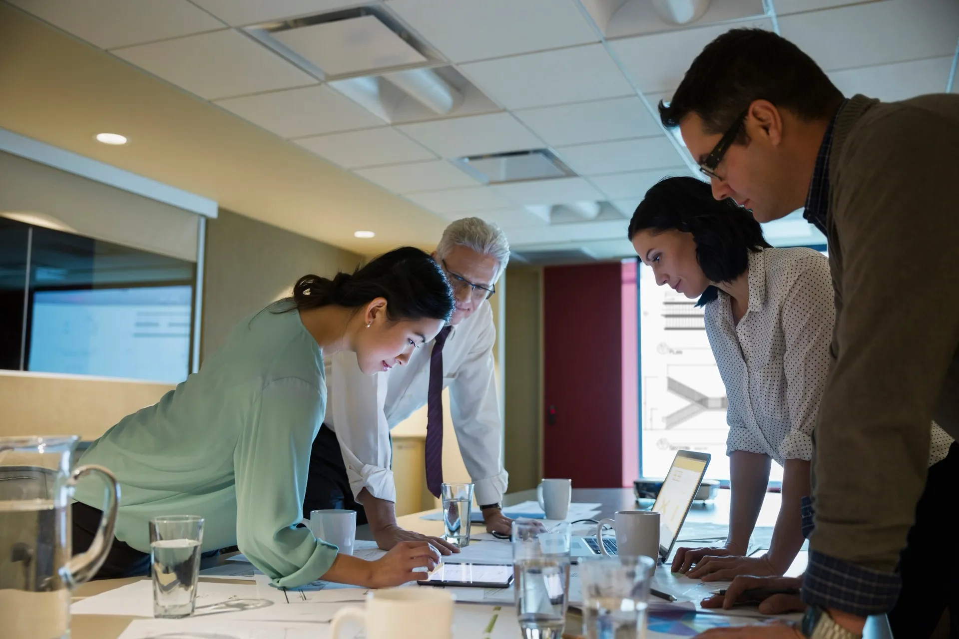 NZ business team reviewing AI-powered data insights in a meeting