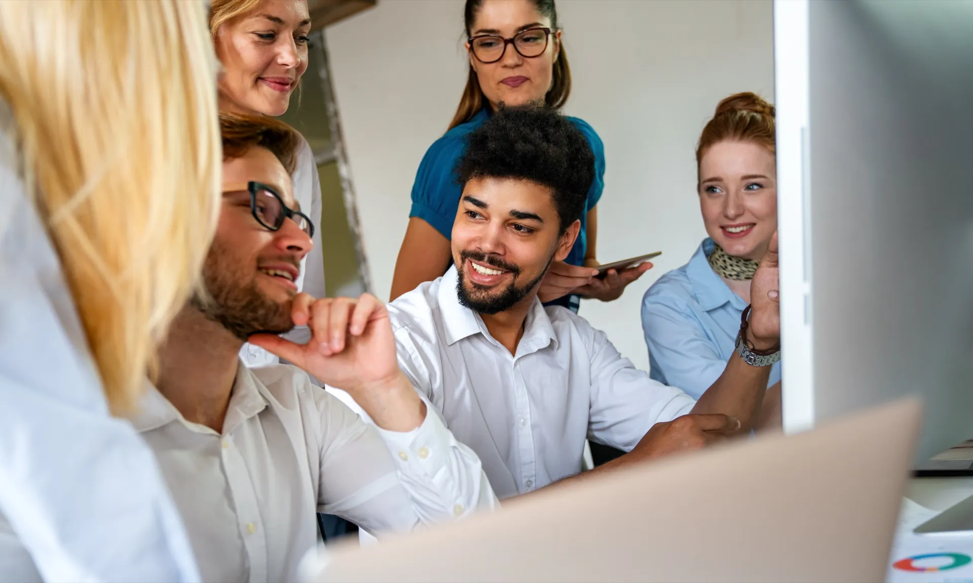 Team learning AI tools in a practical training session